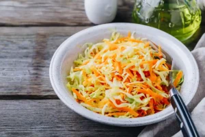 Learn how to make Pineapple Coleslaw, a sweet and tangy twist on classic coleslaw, perfect for BBQs, sandwiches, and summer meals.